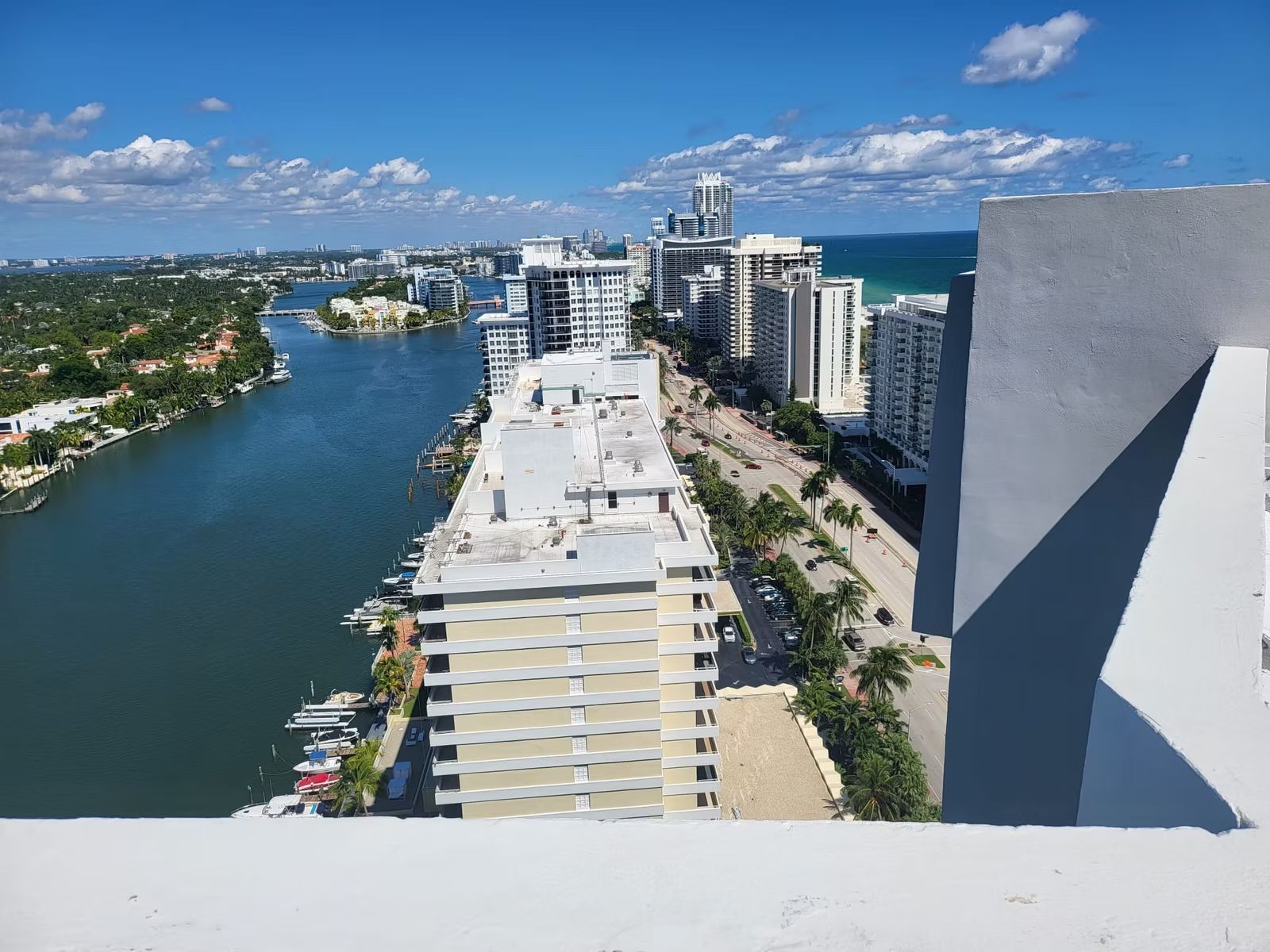 View from a high-rise rooftop over the Intracoastal Waterway and neighboring condominium towers
